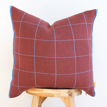 Load image into Gallery viewer, Modern grid cotton pillow cover in wine red with blue stitched edges on wooden stool