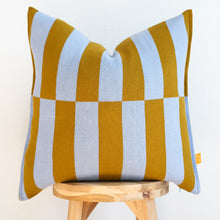Load image into Gallery viewer, bold striped cotton pillow cover in mustard and sky blue on wooden stool