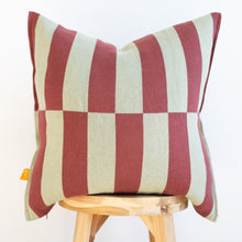 Load image into Gallery viewer, bold striped cotton pillow cover in wine and mint green on wooden stool