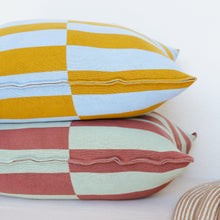 Load image into Gallery viewer, Bold striped and checkerboard cotton pillow covers in mustard, sky blue, wine, and mint green on a beige sofa with knit throw