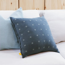 Load image into Gallery viewer, Deep teal blue knit pillow cover with soft square checker pattern, styled on a neutral sofa with coordinating textured pillows in a cozy, minimal living space.
